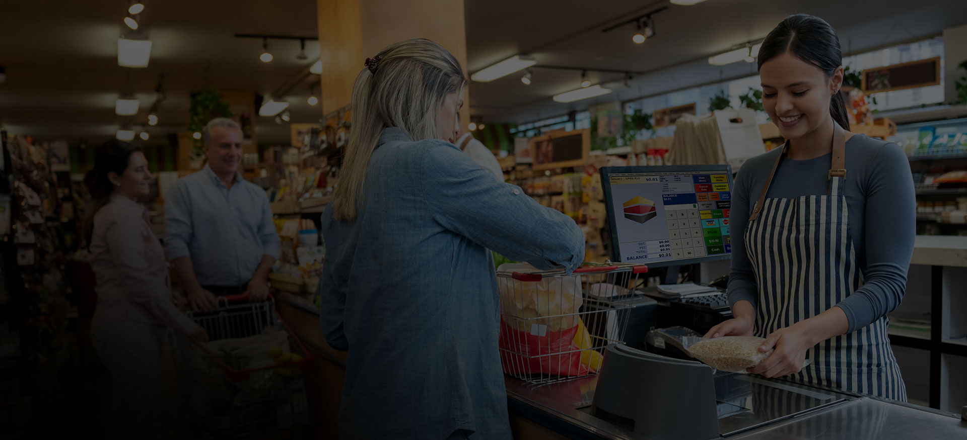 Image of people using POS from groceries at checkout